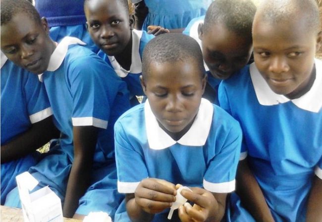 Kenyan school girl shows how to use a Mooncup menstrual cup