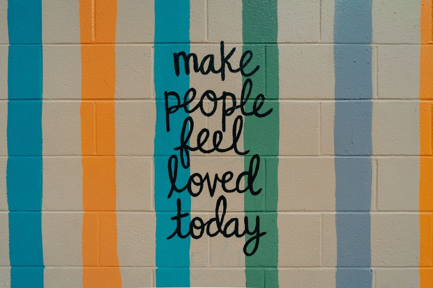 make people feel loved today text on the wall